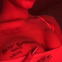 a woman with a tattoo on her chest